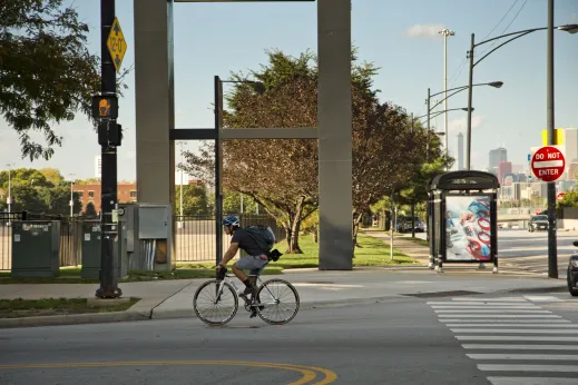 Cyclist riding a bike near apartments in Fuller Park Chicago