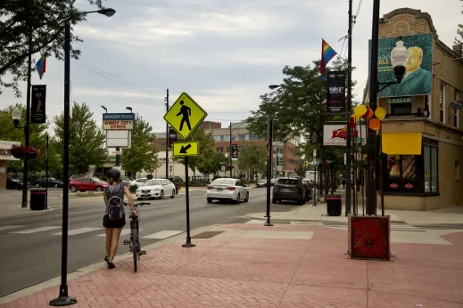 Cyclist walking on bike street in Buena Park Chicago