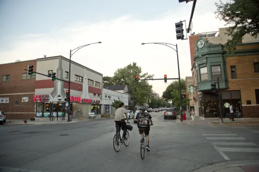 Cyclists crossing street in Hamlin Park Chicago