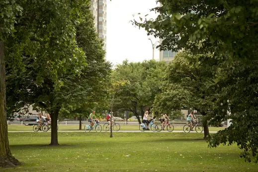 Cyclists on lakefront trail bike path in Lakeview Chicago