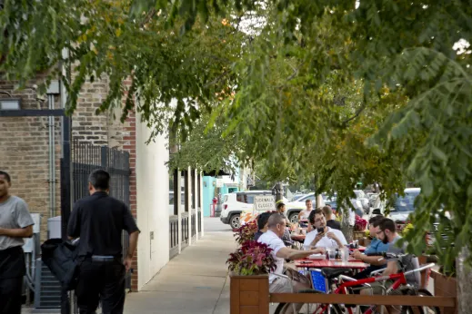 Diners at outdoor restaurant patio near DePaul University Lincoln Park Campus