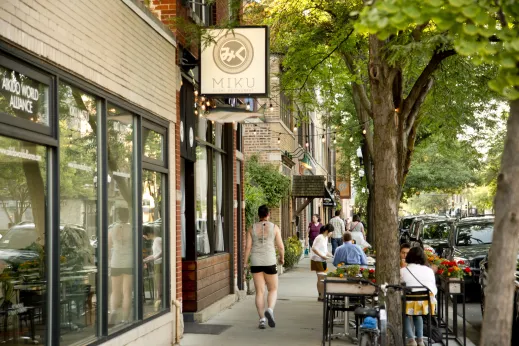 Diners sitting at outdoor patio seating on North Lincoln Avenue restaurants in Lincoln Square Chicago