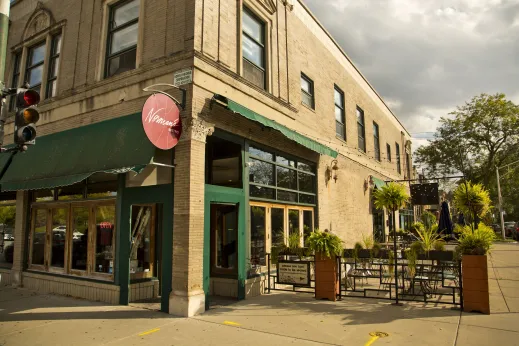 Front entrance to Norman's Bistro and Cafe below apartments in Oakland Chicago