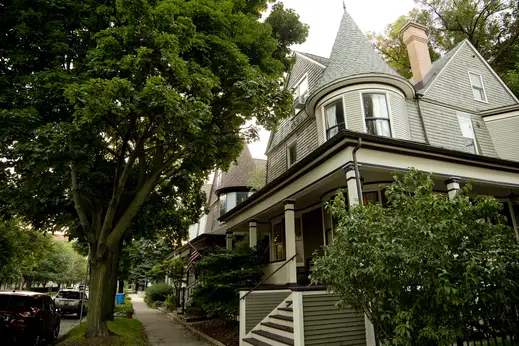 Front porch and corner turret on vintage single family home in Graceland West