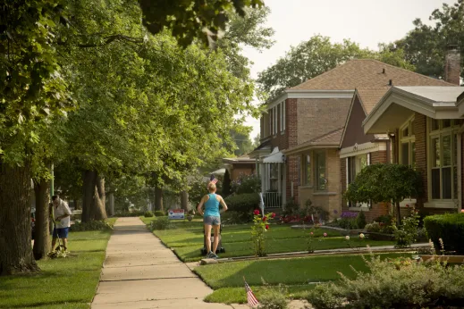 Homeowners doing yard work in front lawns in Peterson Park