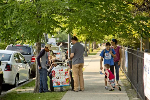 Ice cream vendor and customers on sidewalk in Ravenswood Chicago