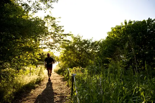 Jogger on lakefront trail near Montrose Harbor in Uptown Chicago