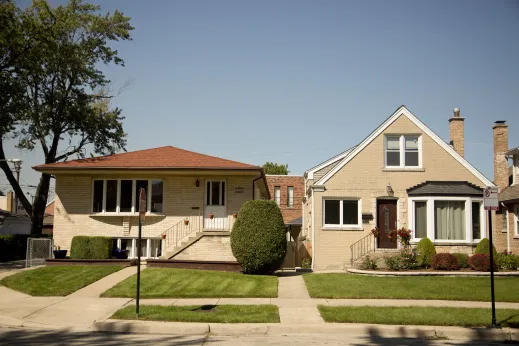 Limestone brick houses and front gardens in Edison Park