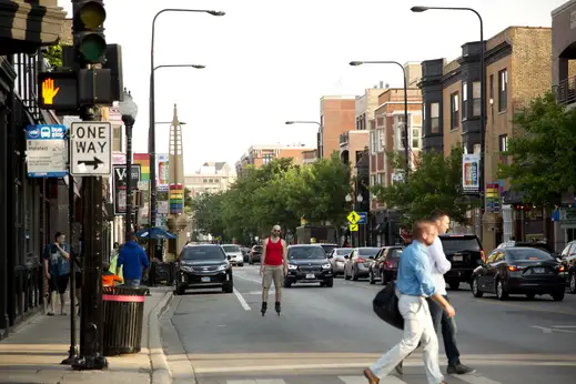 Man rollerblading on North Halsted Street in Boystown by Lakeview Chicago