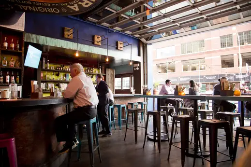 Man sitting on barstool at bar in River North Chicago