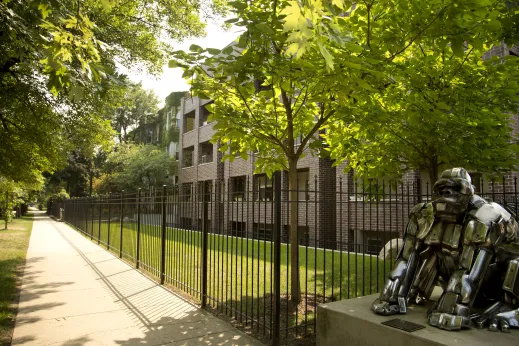 Metallic gorilla sculpture outside apartment buildings in Sheridan Park Chicago