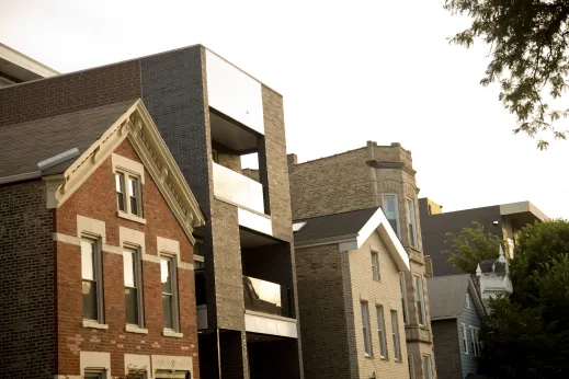 Modern apartment balconies between vintage apartments in Noble Square