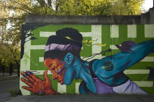 Mural painted on concrete embankment near apartments in South Shore Chicago