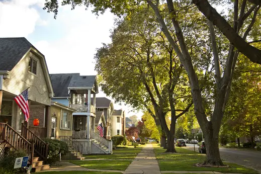 Neighborhood street and sidewalk by homes and apartments in Old Irving Park Chicago