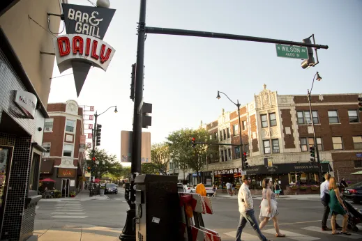 Pedestrians crossing North Lincoln Avenue at Wilson Avenue in Lincoln Square Chicago