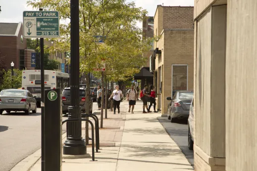 Pedestrians walking on W Foster Ave in North Park Chicago