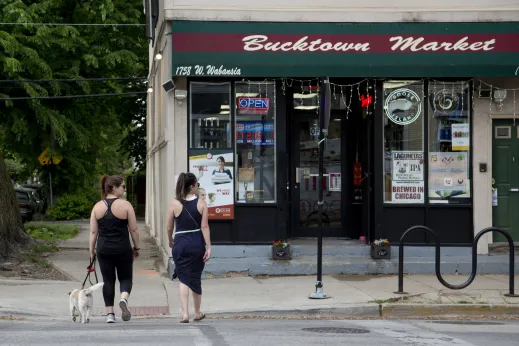 Pedestrians walking dog in Bucktown Chicago