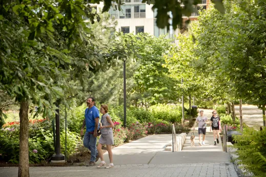 Pedestrians walking on public park ramp in Lakeshore East Chicago