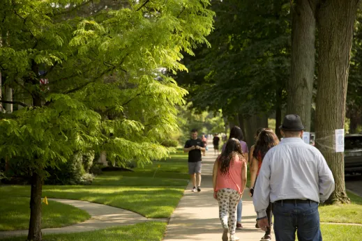 Pedestrians walking on sidewalk on residential street in Lakewood Balmoral