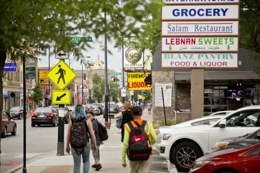 People walking in front of shopping plaza in Albany Park Chicago