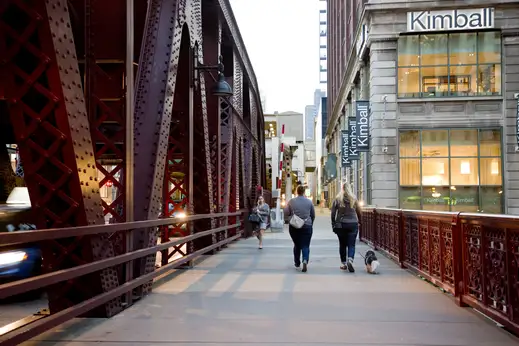 People crossing Wells Street bridge in River North Chicago