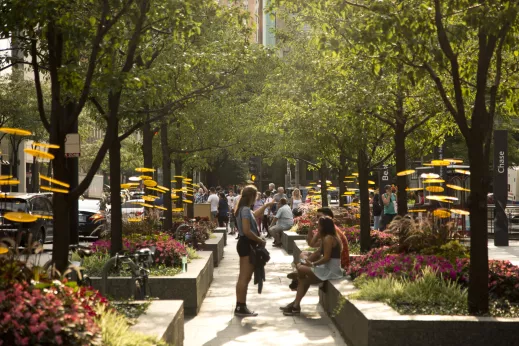 People resting in park at 875 N Michigan Ave in the Gold Coast Chicago