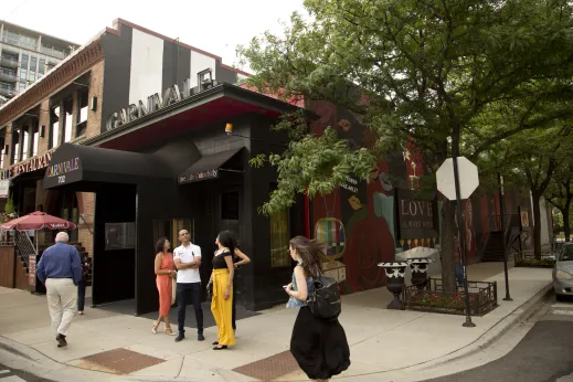 People standing outside Carnivale restaurant in Fulton Market Chicago