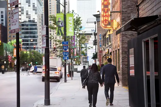 People walking on N Clark St by Portillo's restuarant in River North Chicago