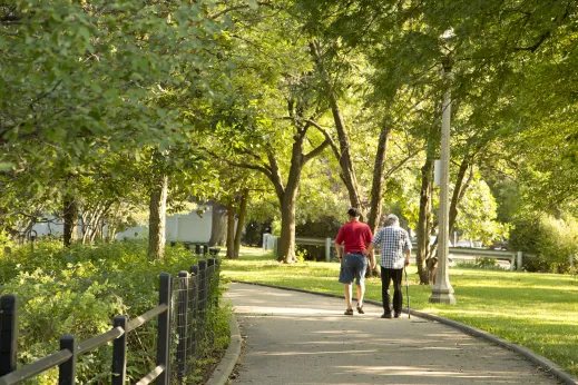 People walking on path in public park in North Mayfair