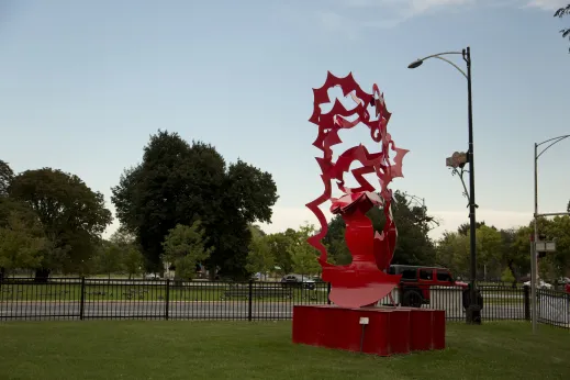 Public art metal sculpture in park near apartments in West Garfield Park Chicago