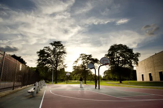 Public basketball courts in park near apartments in North Lawndale Chicago