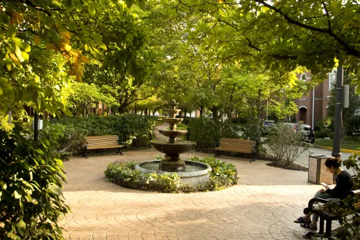 Public square fountain and park benches in Sauganash