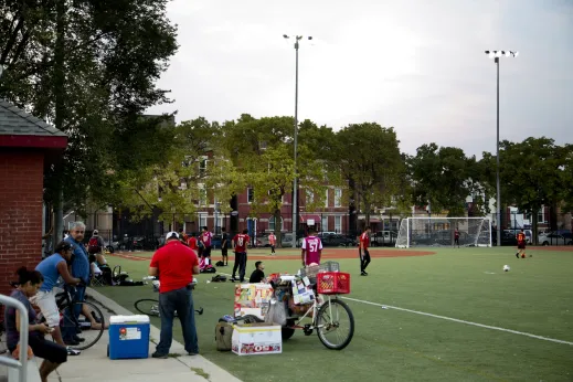 Recreational soccer league players in public park in Pilsen Chicago