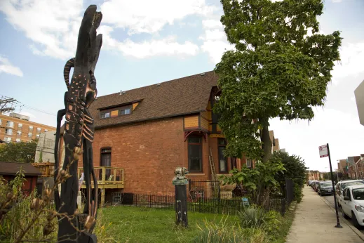 Sculpture garden near apartments on neighborhood street in Oakland Chicago