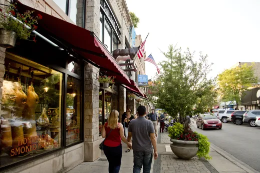 Shoppers and pedestrians stroll down North Lincoln Avenue in Lincoln Square Chicago