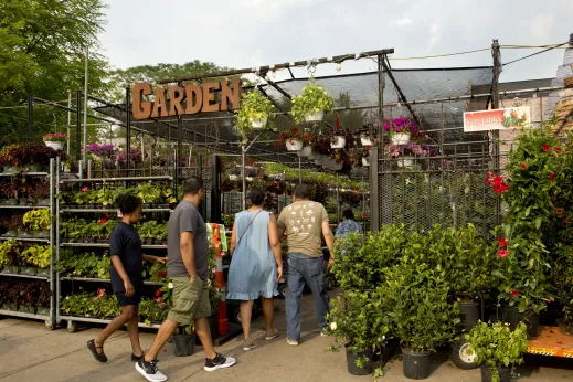 Shoppers walking in garden center entrance in Humboldt Park