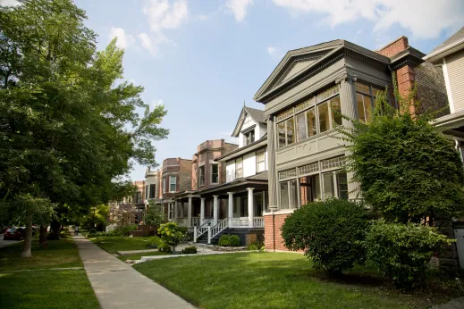 Sidewalk and front lawns of single family homes in Ravenswood Chicago