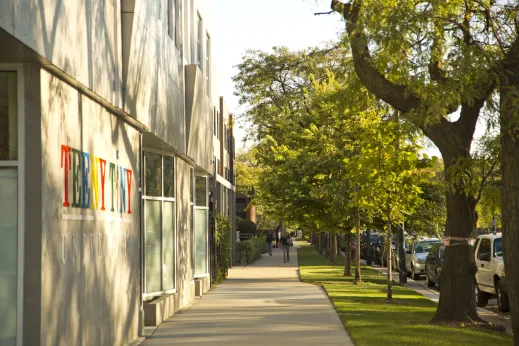 Sidewalk with retail and apartments in Woodlawn Chicago