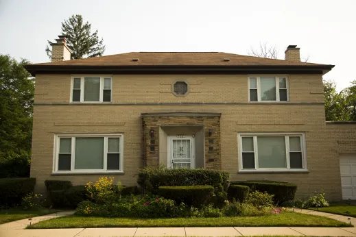 Single family home with topiary front lawn in Peterson Park