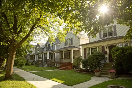 Single family homes and front yards on neighborhood street in North Mayfair