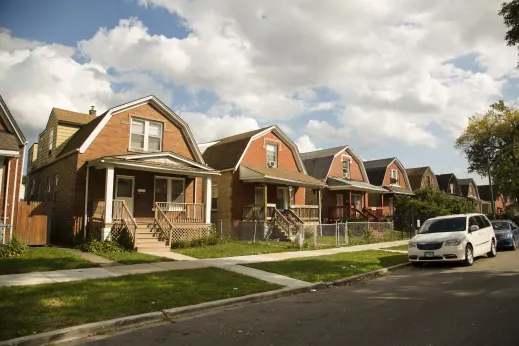 Single family homes near apartments on neighborhood street in Austin Chicago