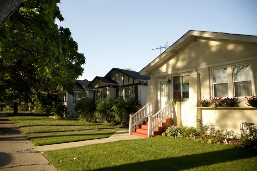 Stucco clad bungalow houses and front lawns in West Ridge Chicago