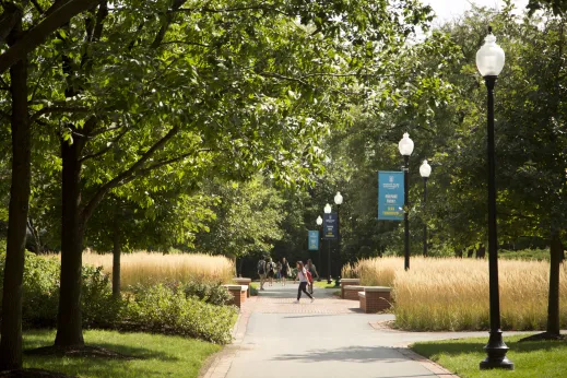 Students walking across campus ground by North Park University in North Park Chicago