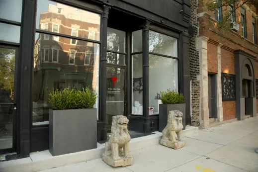 Traditional Chinese stone lion sculptures outside art gallery entrance in Bridgeport Chicago