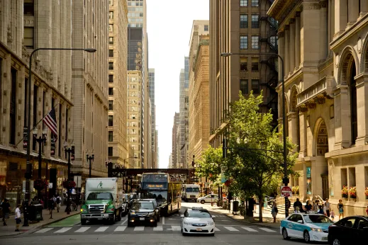 Trucks, cars, and sightseeing bus in downtown Chicago Loop