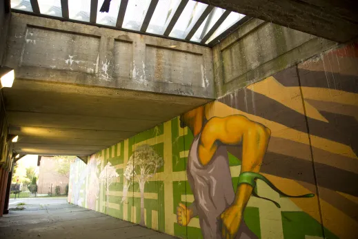 Viaduct painted with colorful mural near apartments in Woodlawn Chicago