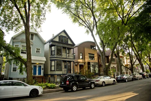 Vintage and modern apartment buildings and parked cars in Roscoe Village