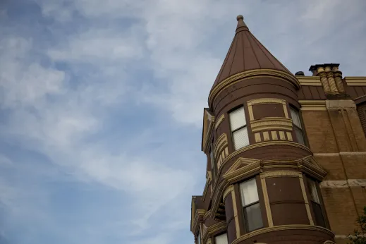 Vintage apartment building with corner turret in Noble Square Chicago