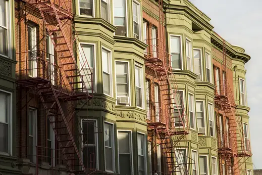 Vintage apartment building exterior and fire escapes in Lakeview Chicago