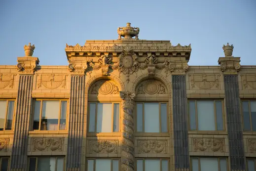 Vintage apartment building with terra cotta facade detail in Uptown Chicago